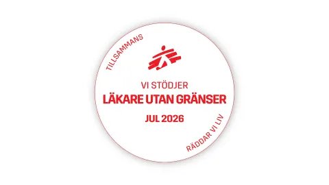 runt vitt embelem med röd text "vi stödjer läkare utan gränser jul 2026"