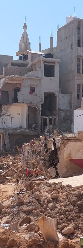 förstörda byggnader i Derna i Libyen efter stora översvämningar