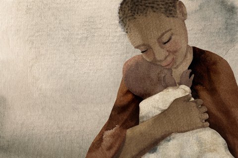 En mamma med sitt nyfödda barn i famnen inlindat i en filt