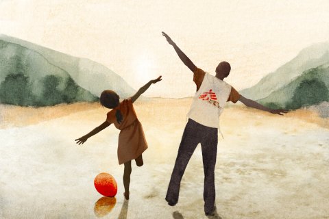 En flicka med amputerat ben står med armarna utsträckta bredvid en man i Läkare Utan Gränser-väst i solnedgången