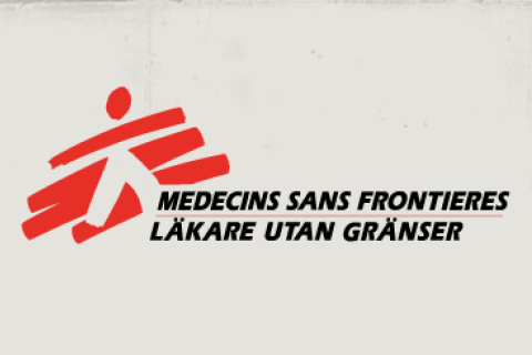 Läkare Utan Gränsers logotyp mot en beige bakgrund