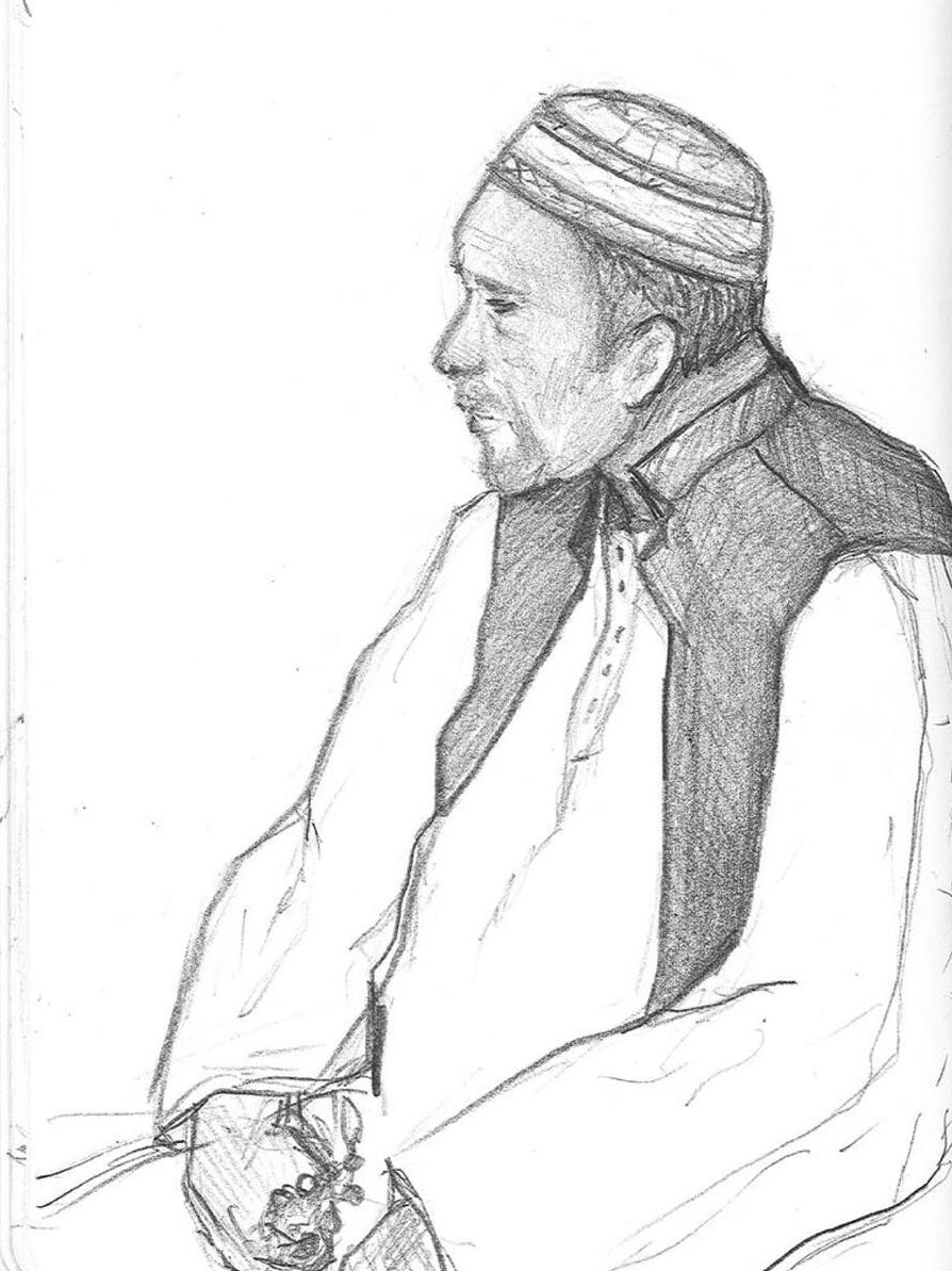 Illustration av en man som sitter ner.